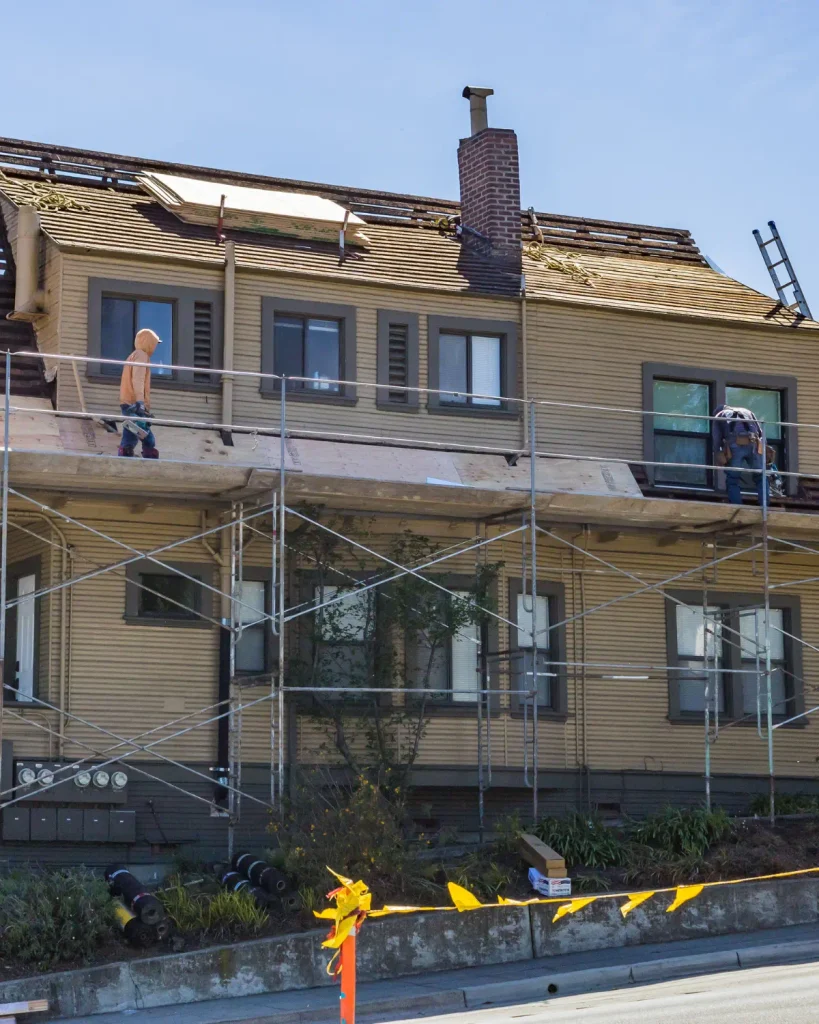 Roofing contractor working on a residential roof in Portland
